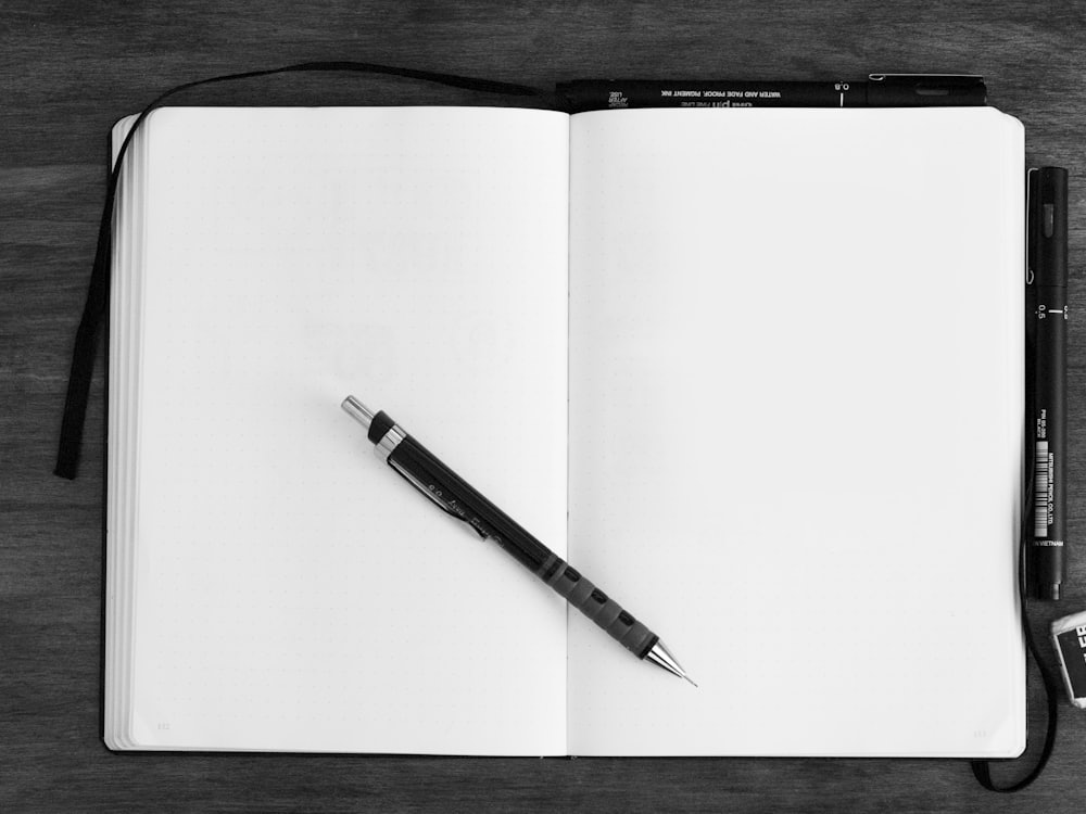 An open notebook and pen