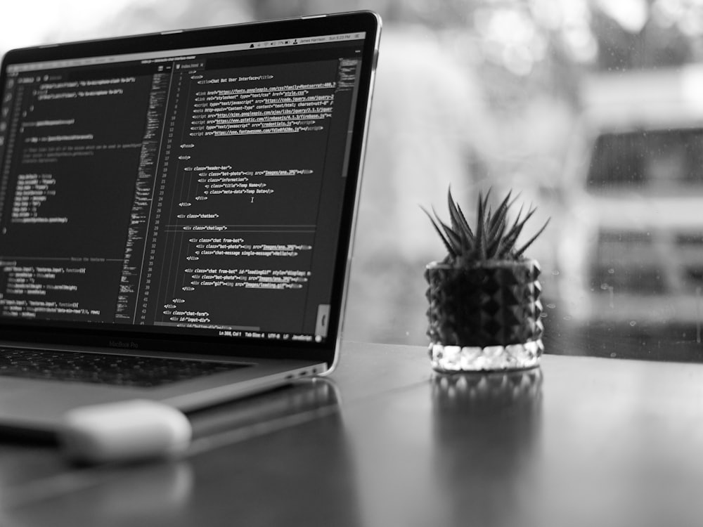 A laptop open at a workspace